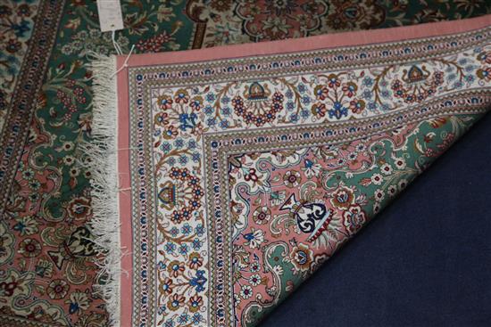 An Isphahan style silk rug, 4ft 9in by 3ft 4in.